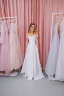 Belosnezhnoe dress made of dense satin with off-shoulder neckline